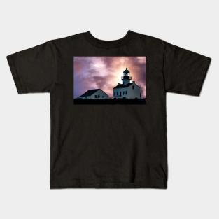 Sunset over a lighthouse Kids T-Shirt